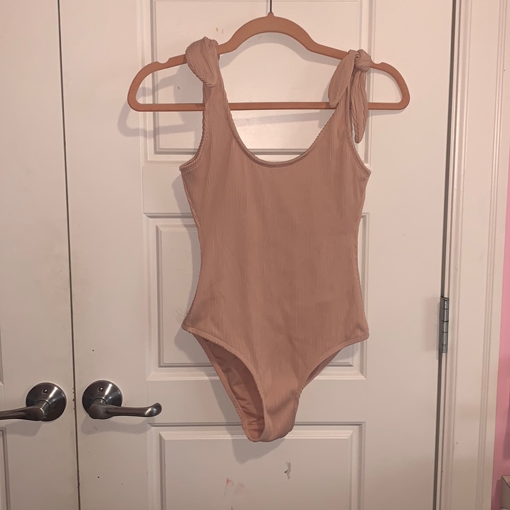 Pink Kensie One Piece with an open back and knots on either shoulder
